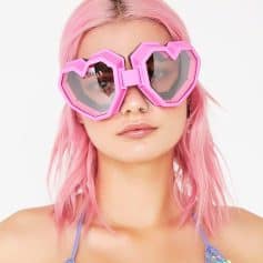 Pink heart-shaped sunglasses for women with trendy, fun style. Unique accessory from Monalisa Store to enhance your fashion statement. Perfect for casual and festival wear.