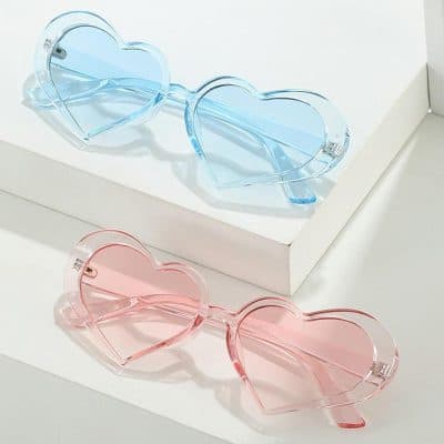 Blue and pink heart-shaped sunglasses perfect for trendy, fashionable eye accessories and UV protection. Eye-catching, fun, and perfect for summer or special occasions.