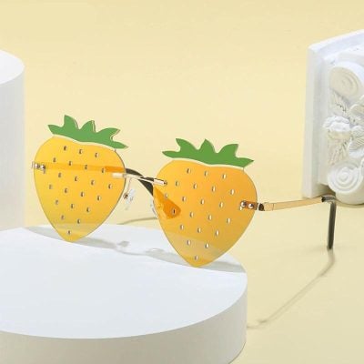 Stylish strawberry-shaped sunglasses with UV protection, perfect for fashion-forward individuals seeking unique and fun eyewear.