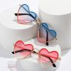Fun heart-shaped sunglasses with pink and blue tinted lenses, perfect for fashionable summer accessories. Stylish and trendy eyewear designed for women who want to make a statement.