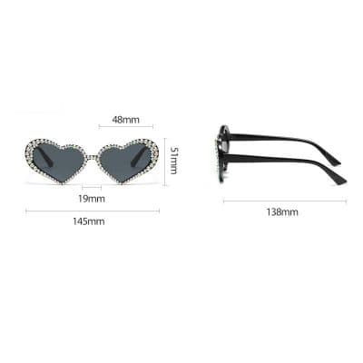 Fashionable heart-shaped sunglasses with rhinestones, perfect for trendy eyewear and sun protection.