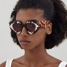 Stylish heart-shaped sunglasses featuring rhinestones, leopard print arms, perfect for fashion-forward eyewear enthusiasts. Elevate your look with trendy, glamorous sunglasses from Monalisa Store.