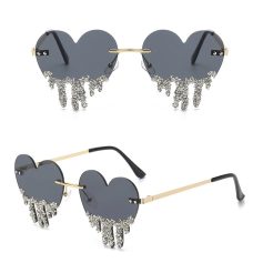 Heart-shaped sunglasses with rhinestone dripping design, perfect for stylish women’s eyewear and accessory collection.