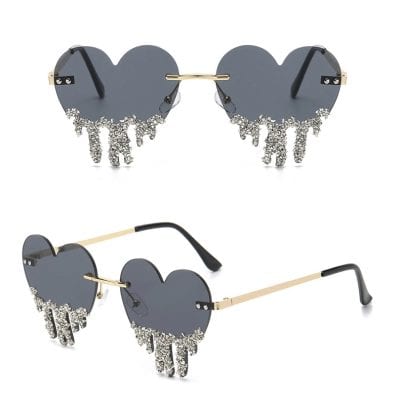 Heart-shaped sunglasses with rhinestone dripping design, perfect for stylish women’s eyewear and accessory collection.