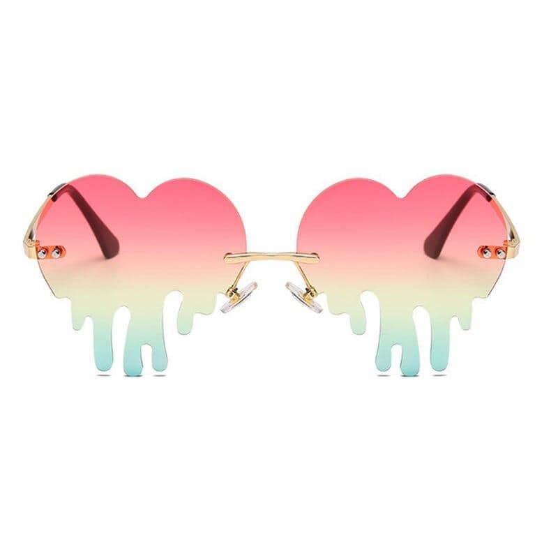 Stylish heart-shaped sunglasses with pink-to-mint gradient lenses and melting drip design, perfect for trendy optical fashion accessories.