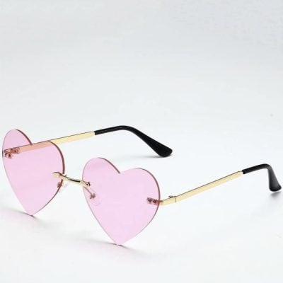 Heart-shaped pink sunglasses with stylish gold arms and black temple tips, perfect fashionable eyewear for women and teens, available at Monalisa Store.