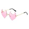 Stylish pink heart-shaped sunglasses with gold accents, ideal for fashionable women seeking trendy optical eyewear and summer accessories.
