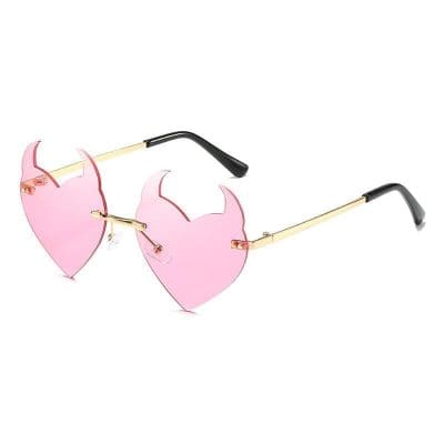 Stylish pink heart-shaped sunglasses with gold accents, ideal for fashionable women seeking trendy optical eyewear and summer accessories.