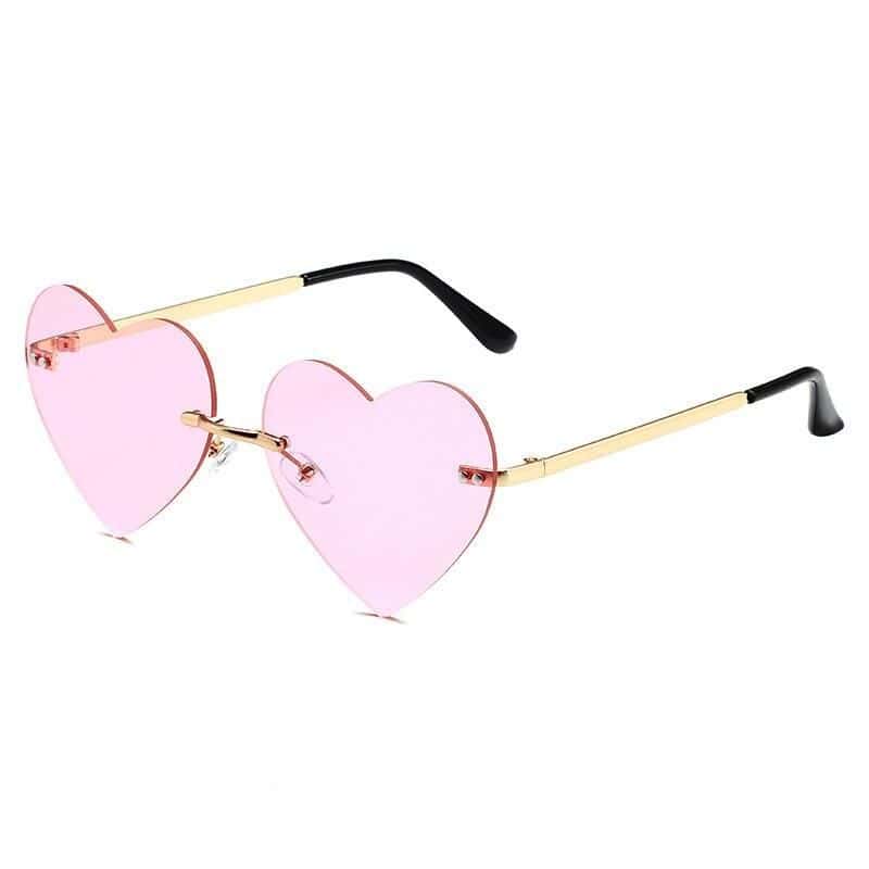 Fashionable pink heart-shaped sunglasses for women, trendy eyewear accessory for stylish outings, perfect for summer and festival looks.