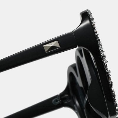 Stylish black sunglasses with rhinestone embellishments, perfect for modern fashion enthusiasts seeking high-quality optical accessories.