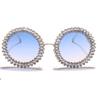 Elegant round sunglasses with crystal-studded frames for stylish sun protection and fashion-forward looks. Perfect for fashion enthusiasts and trendsetters seeking unique eyewear.