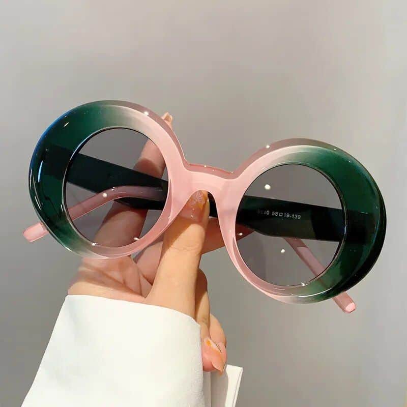 Stylish pink round sunglasses with gradient black lenses, perfect for trendy eyewear fashion and UV protection. Ideal for stylish accessories and enhancing your look.
