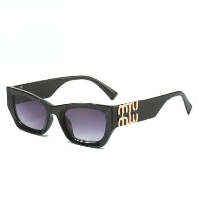 Fashionable black sunglasses with gradient lenses and bold logo accents, perfect for stylish eyewear needs.