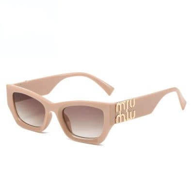 Stylish beige frame sunglasses with gradient lenses, perfect for fashion and eye protection from UV rays. Miu Miu logo detail on temple enhances luxury appeal.