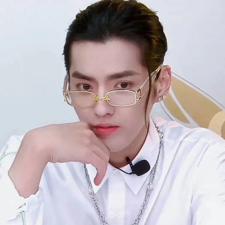 Elegant young man wearing stylish glasses, white shirt, and jewelry, showcasing fashion accessories. Perfect for beauty and fashion trends on Monalisa Store.