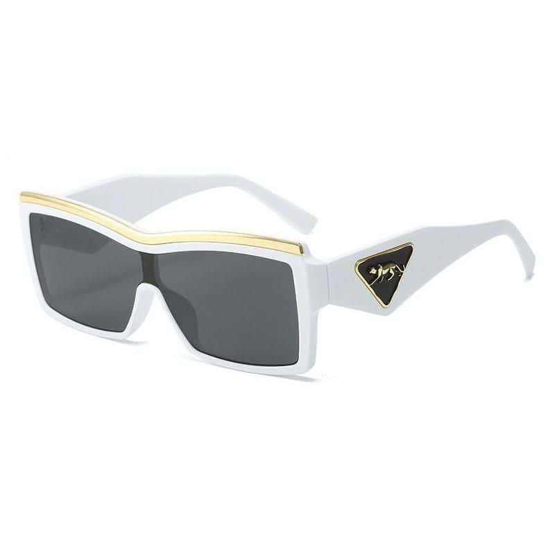 Stylish white and black sunglasses with gold accents, perfect for fashion-forward eyewear lovers. UV protection and high-quality materials ensure both style and comfort.
