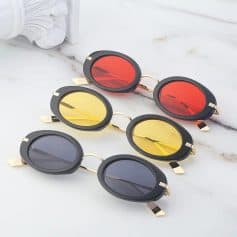 Stylish oval sunglasses in black, yellow, and red mirror lenses for men and women. Perfect for fashion, eye protection, and UV shielding. Trendy sunglasses accessory.