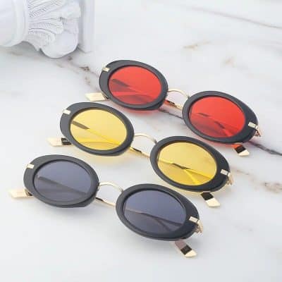 Stylish oval sunglasses in black, yellow, and red mirror lenses for men and women. Perfect for fashion, eye protection, and UV shielding. Trendy sunglasses accessory.