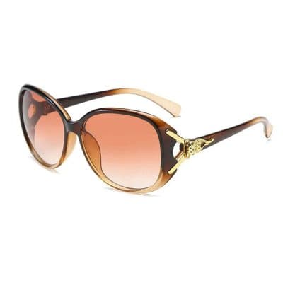 Stylish sunglasses featuring brown gradient lenses and gold accents, perfect for fashion-forward individuals seeking high-quality eye protection.