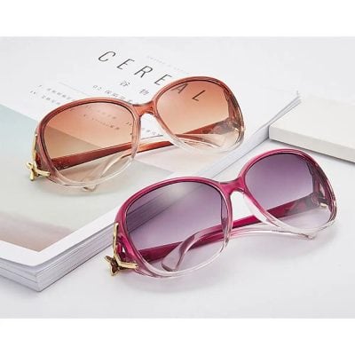 Stylish pink and rose gradient sunglasses with gold accents, trendy eyewear available at Monalisa Store for eye protection and fashion. Perfect for sunny days and summer style.