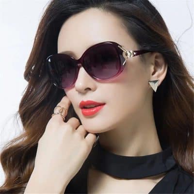 Elegant oversized sunglasses with gradient lenses and designer frames, perfect for fashion-forward women and sun protection features.