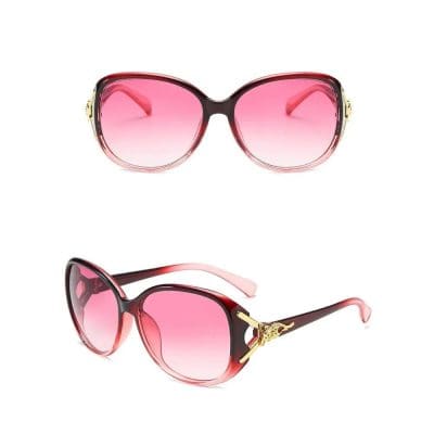 Stylish pink gradient sunglasses with black and gold accents, perfect for sun protection and fashion. Elegant design combines comfort and luxury for women.