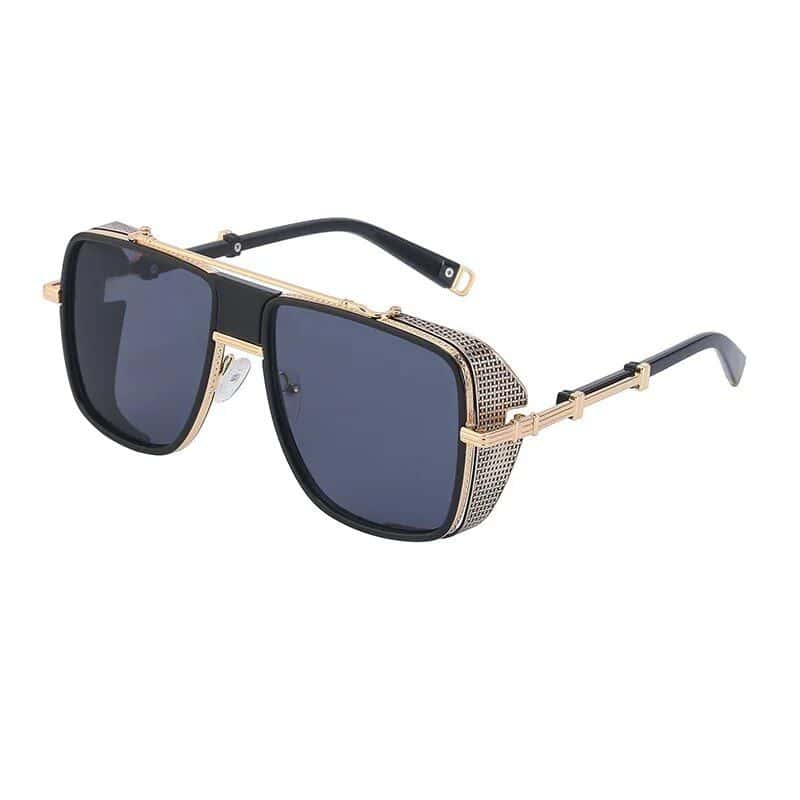 Stylish designer sunglasses with gold accents and tinted lenses, perfect for fashion-forward individuals seeking premium eyewear.