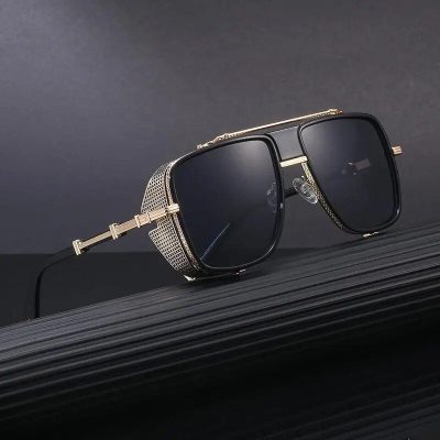 Elegant black designer sunglasses with gold accents and rhinestone embellishments, perfect for fashion-forward eyewear lovers.