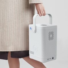 Image of a portable oxygen concentrator being carried by a person, highlighting easy mobility and breathing assistance. Compact design ideal for oxygen therapy patients needing reliable respiratory support.