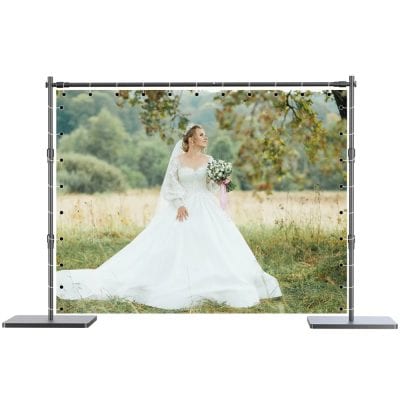 High-resolution outdoor wedding backdrop featuring a bride in a white gown holding a bouquet, perfect for wedding decor and photo booths.