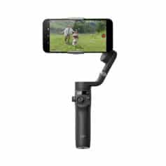 A professional drone gimbal stabilizer with a smartphone mounted for smooth, high-quality video recording during outdoor activities and family moments.