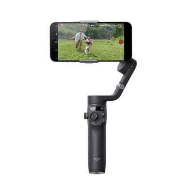 A professional drone gimbal stabilizer with a smartphone mounted for smooth, high-quality video recording during outdoor activities and family moments.