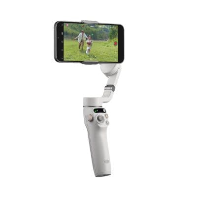 A handheld beauty device with a smartphone attachment for skincare treatments and facial rejuvenation.