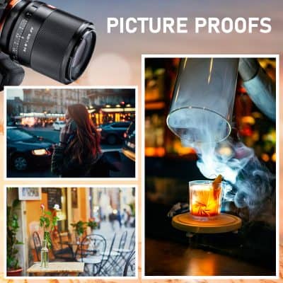 A woman talking on her cellphone in a city street at dusk with blurred city lights in the background.