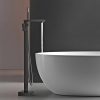Elegant bathroom sink with black floor-mounted faucet, minimalist modern design, ideal for spa, vanity, or luxury home bathrooms, combining style and functionality.
