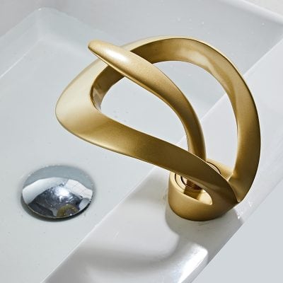 Luxury gold bathroom faucet, sleek and stylish, suitable for contemporary sinks, enhances home decor with high-quality materials and craftsmanship.