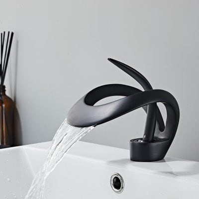 Sleek black water faucet mounted above a white sink, providing a stylish and functional feature for modern bathrooms or salons.