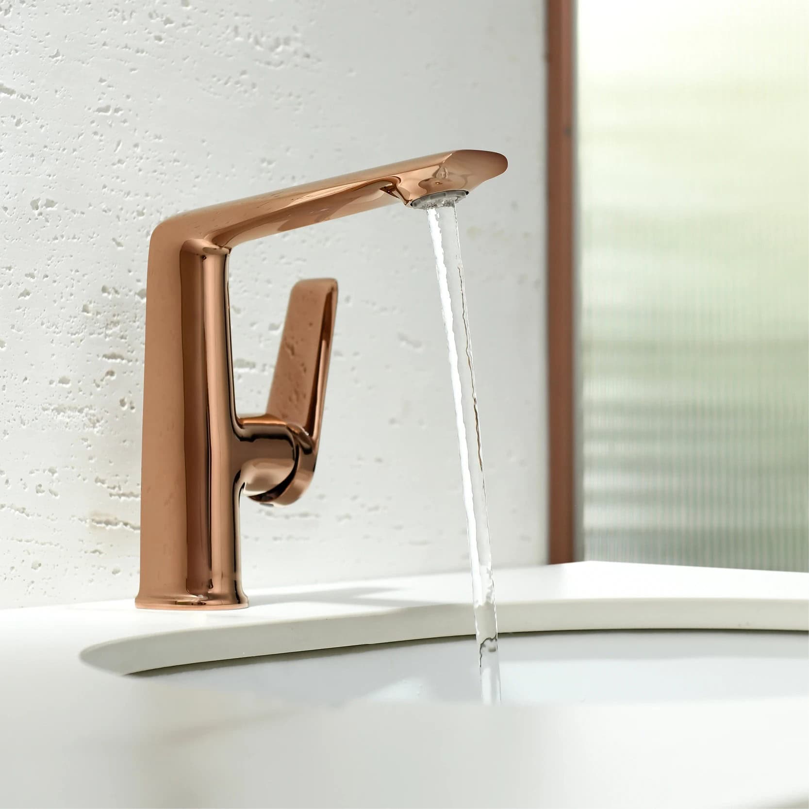 A sleek rose gold faucet with water flowing, set against a white textured wall, showcasing elegant bathroom fixtures ideal for healthcare or modern home use.