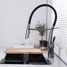 Stylish black and stainless kitchen faucet with pull-down spray head, perfect for modern kitchen sinks. Easy to install and use, enhancing kitchen functionality and aesthetic appeal.