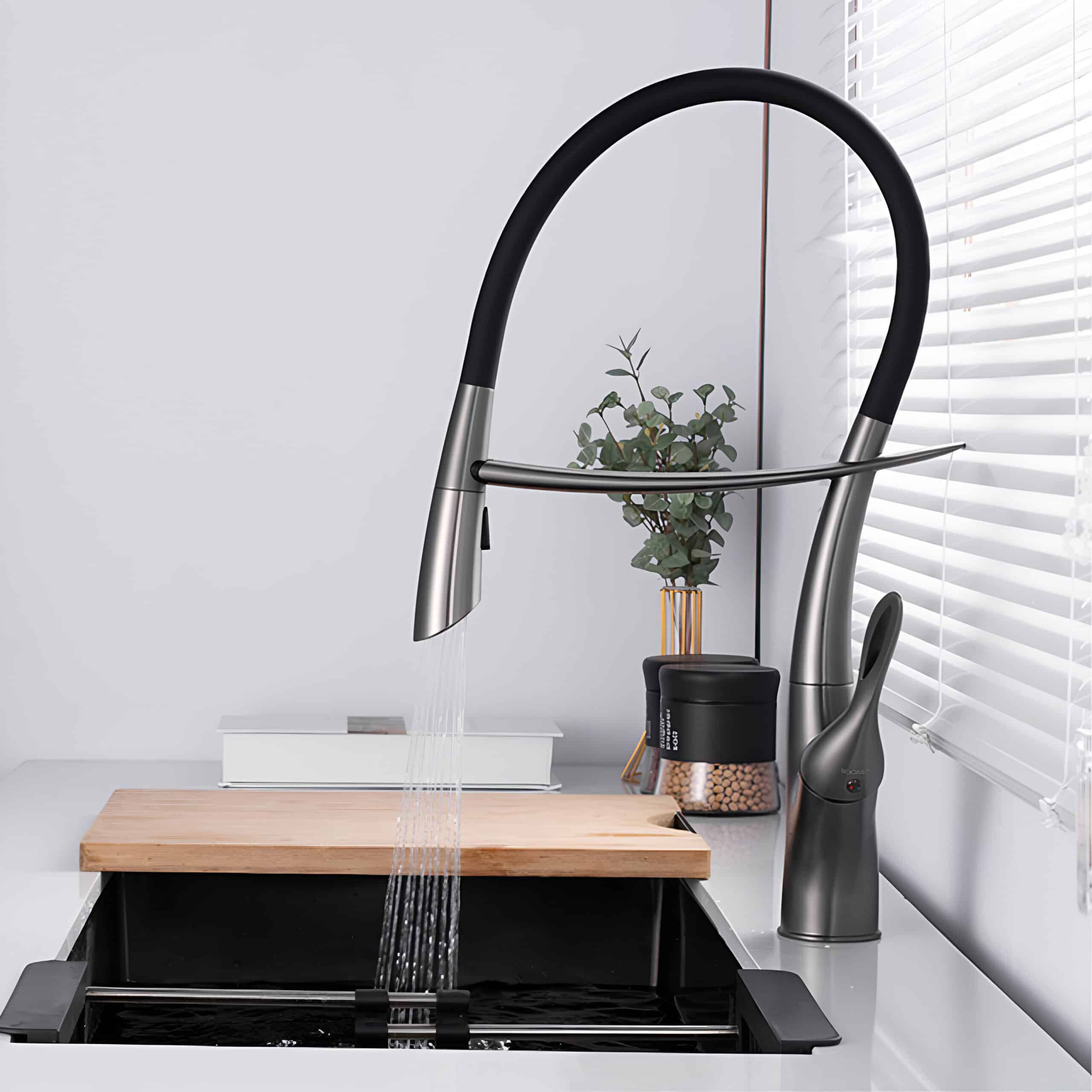 Stylish black and stainless kitchen faucet with pull-down spray head, perfect for modern kitchen sinks. Easy to install and use, enhancing kitchen functionality and aesthetic appeal.