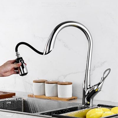 Faucet with pull-down spray head ideal for kitchen sink, featuring sleek chrome design for easy water control and cleaning.