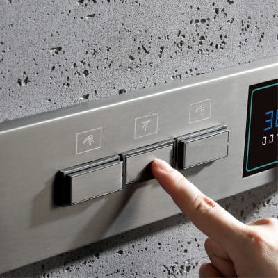 Barbed shower controls on a sleek stainless steel panel for easy access and modern design.