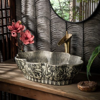 Luxurious Stone Bathtub with floral carvings in a spa-inspired setting.