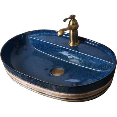 Decorative blue ceramic bathroom sink with brass faucet, ideal for modern and stylish bathroom decor. Durable, artistic, and functional, enhancing your space with a touch of sophistication.