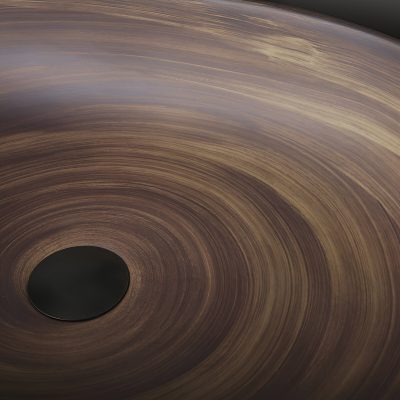 A close-up of a polished wooden table or round wood art featuring concentric circles, highlighting natural wood grain patterns ideal for interior design and decor purposes.