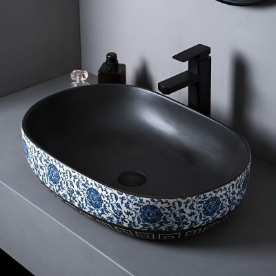 Stylish black and blue ceramic bathroom sink with floral design, perfect for modern bathroom decor. Features durable craftsmanship and elegant aesthetics for a sophisticated look.