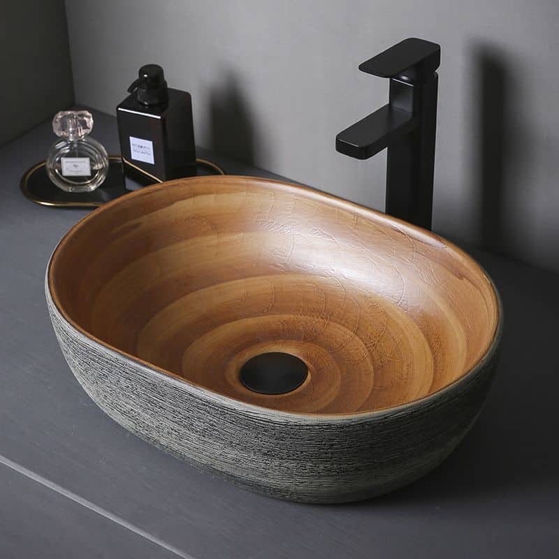 A stylish wooden vessel sink with a sleek black faucet, complementing modern bathroom decor. Ideal for luxury bathrooms, offering a natural aesthetic for skincare and grooming routines.