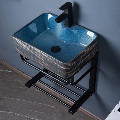 Stylish blue bathroom sink with sleek black faucet, modern design, and durable material. Perfect for contemporary bathrooms seeking an elegant, functional touch.