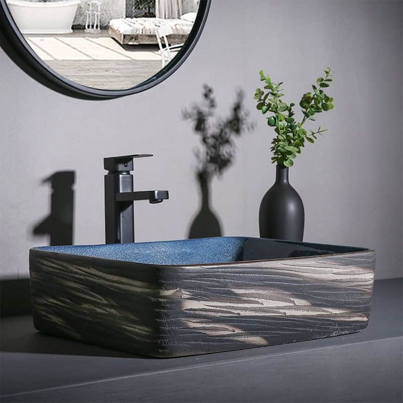 Stunning black faucet and stylish sink designed for eye exam clinics. Ideal for optical offices seeking sleek, functional sink solutions.