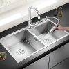 Modern stainless steel kitchen sink with high-arc faucet, dual basins, and removable spray nozzle for easy cleaning and versatile use.